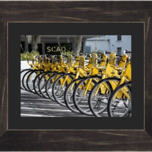 Black Distressed framed 8x10 photo of yellow bicycles arranged diagonally in front of SCAD sign at Ruskin Hall in Savannah, GA